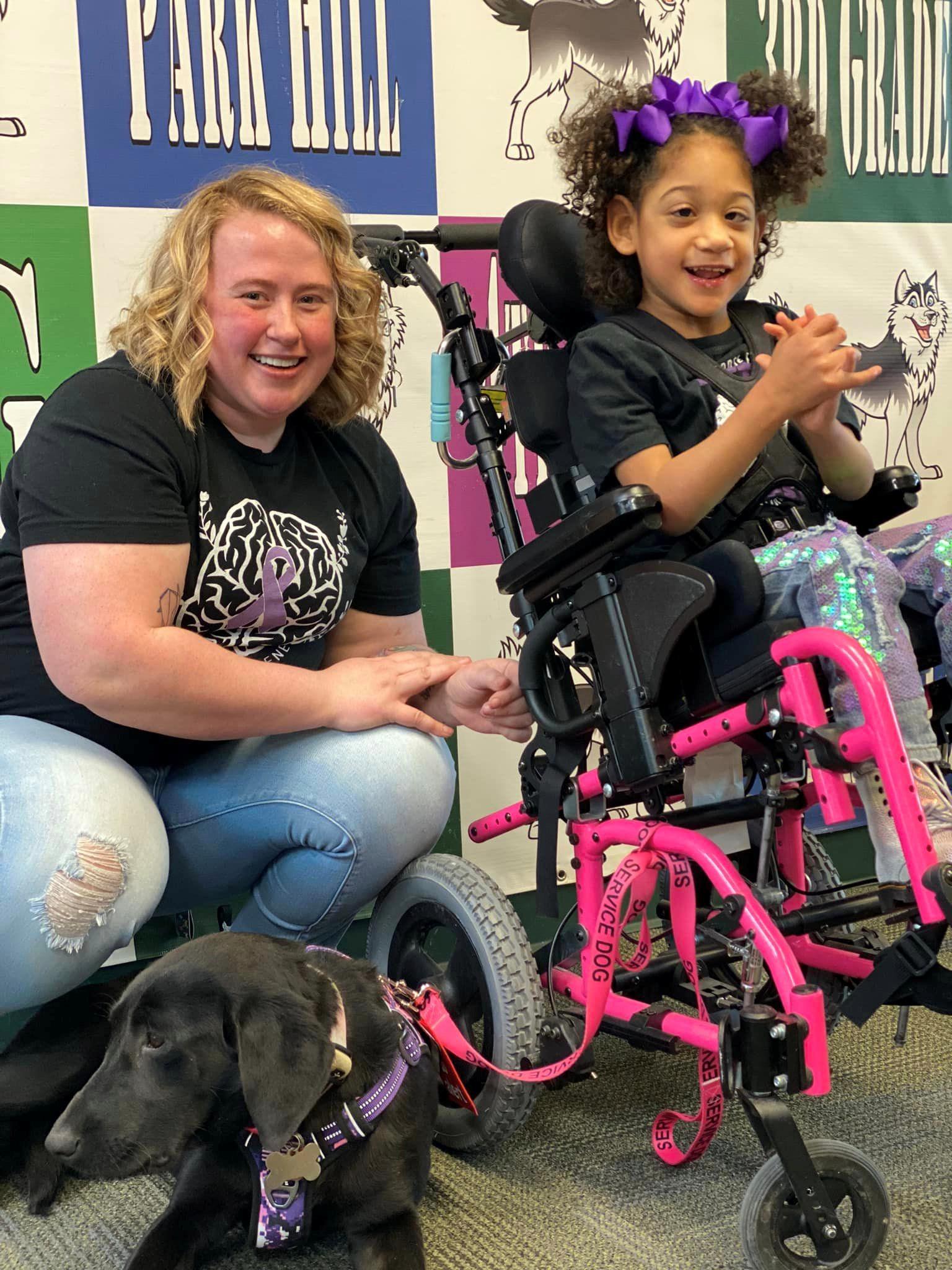 Corbynn and Remi the service dog in training to be a seizure response dog